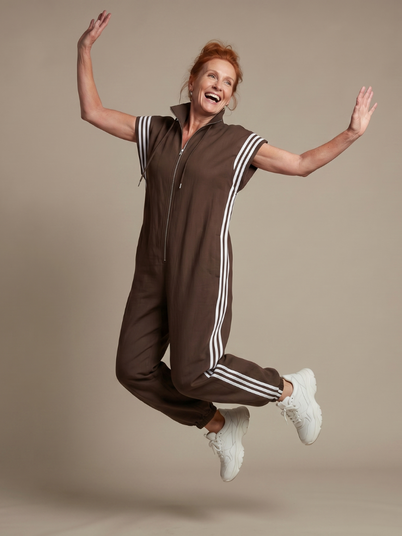 Women's jumpsuit with zipper and stripe details
