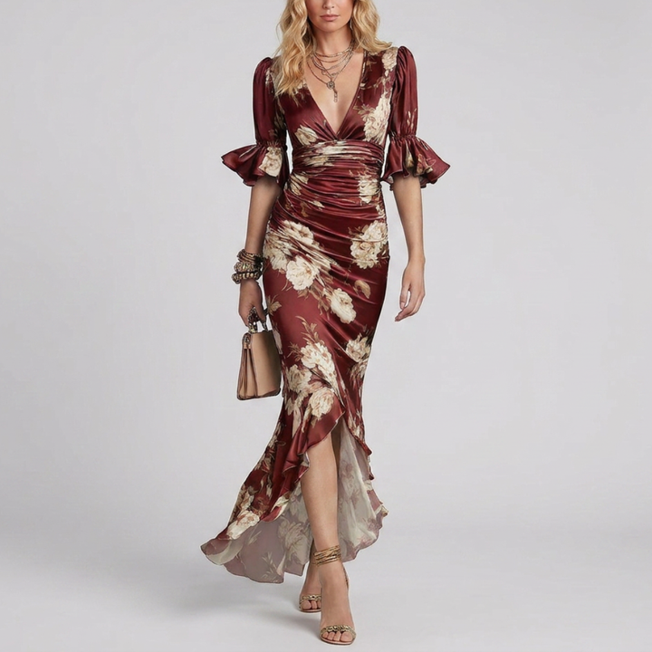 Long green satin dress with an asymmetrical cut