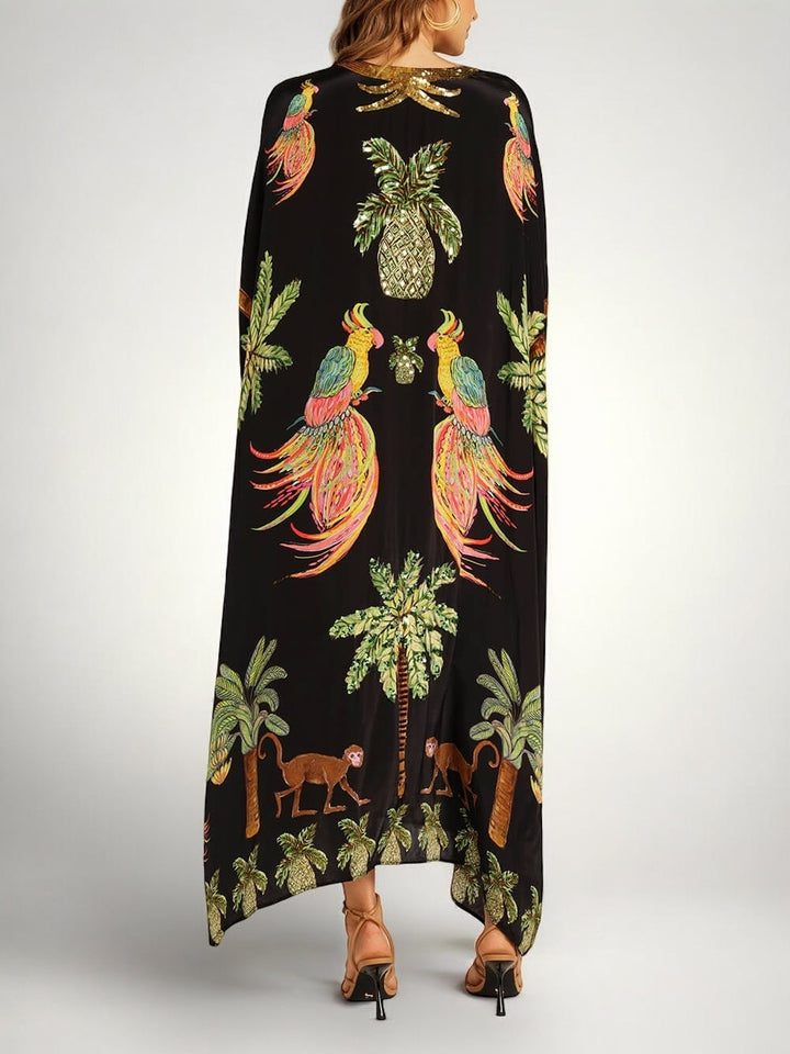 Løs dame-kjole med kokospalmeprint og drop shoulder