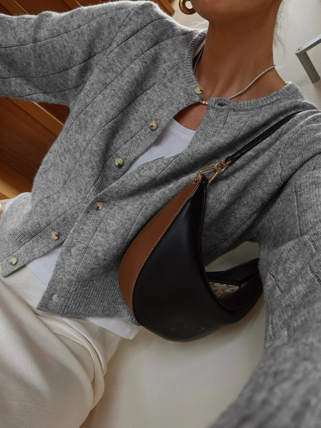 Soft cardigan with a round neckline and button closure for women