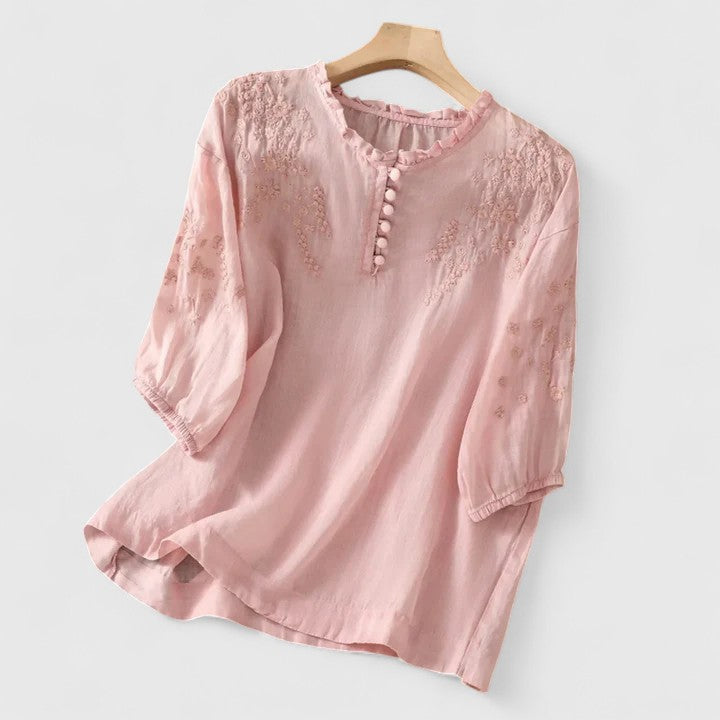 Women's blouse with front button closure