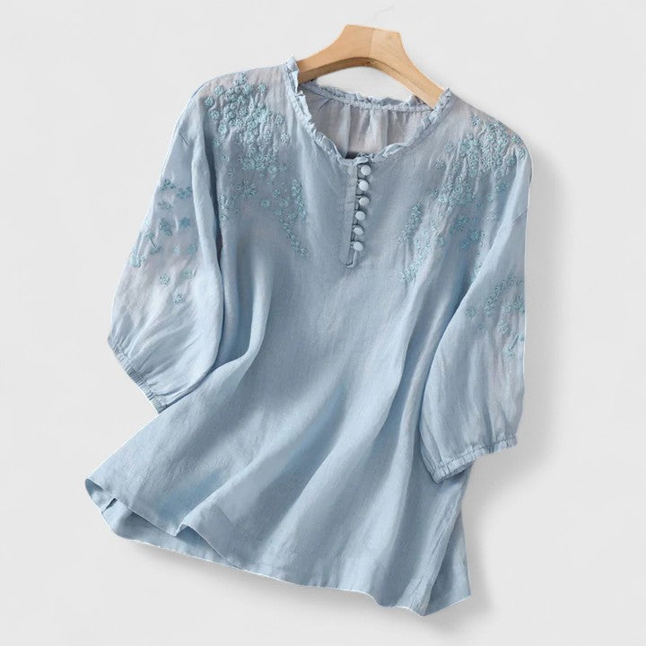 Women's blouse with front button closure
