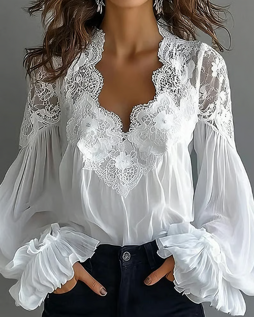 Dame-bluse i blomstret blonde med lanterneærmer