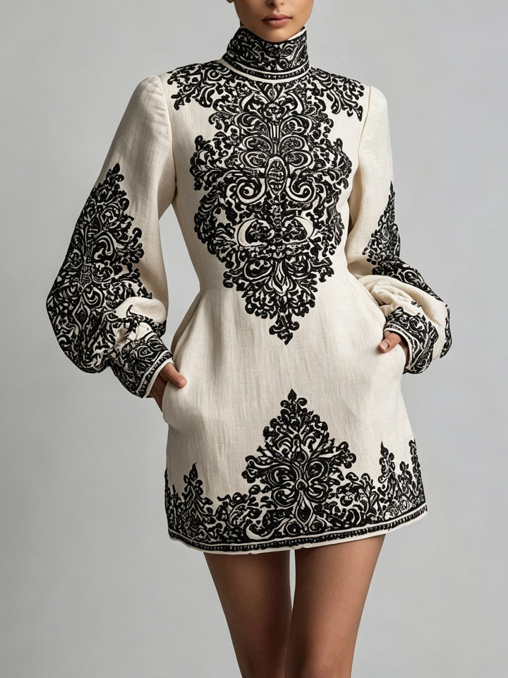 Women's mini dress with ornate pattern, high neckline and long sleeves