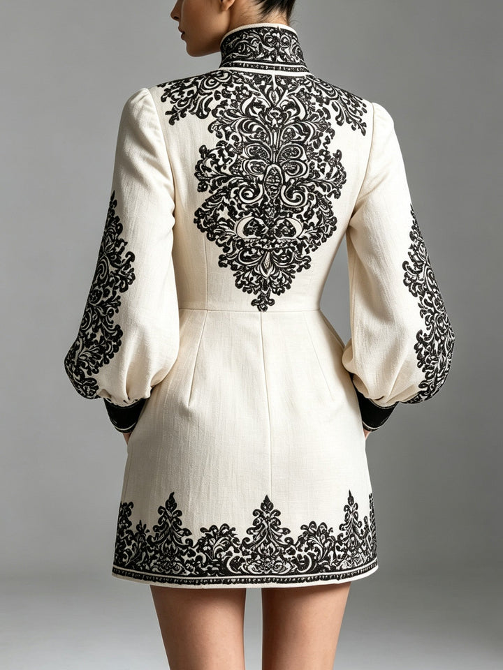 Women's mini dress with ornate pattern, high neckline and long sleeves