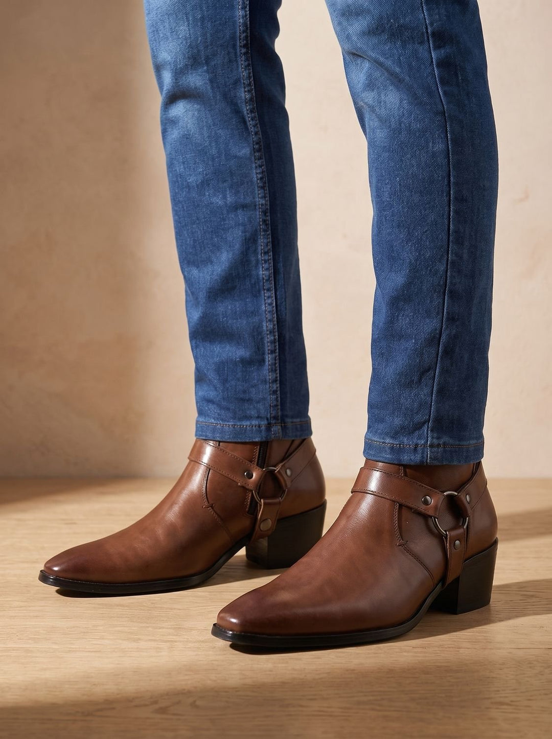 Leather boots with a strap and pointed toe for men