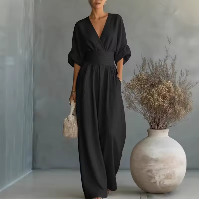Elegant women's jumpsuit with a deep V-neckline and wide legs