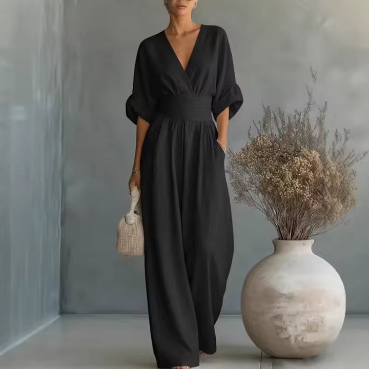 Elegant women's jumpsuit with a deep V-neckline and wide legs