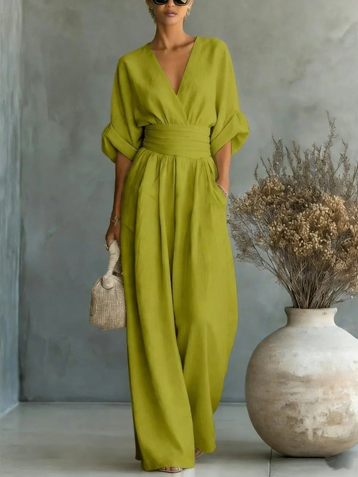 Elegant women's jumpsuit with a deep V-neckline and wide legs