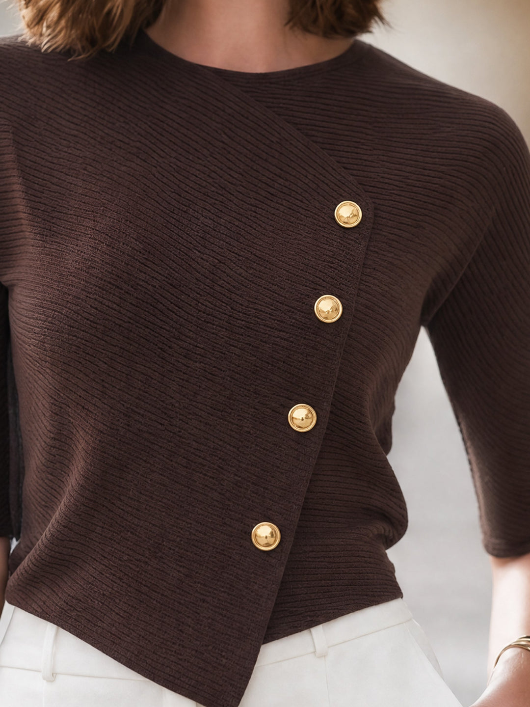 Ribbed knit top with an asymmetrical button closure for women