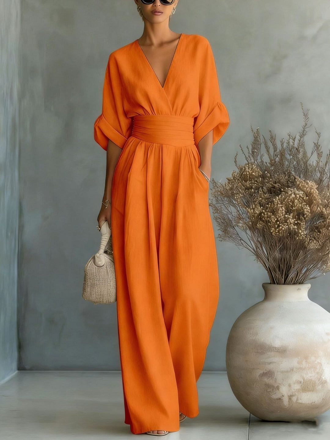Elegant women's jumpsuit with a deep V-neckline and wide legs