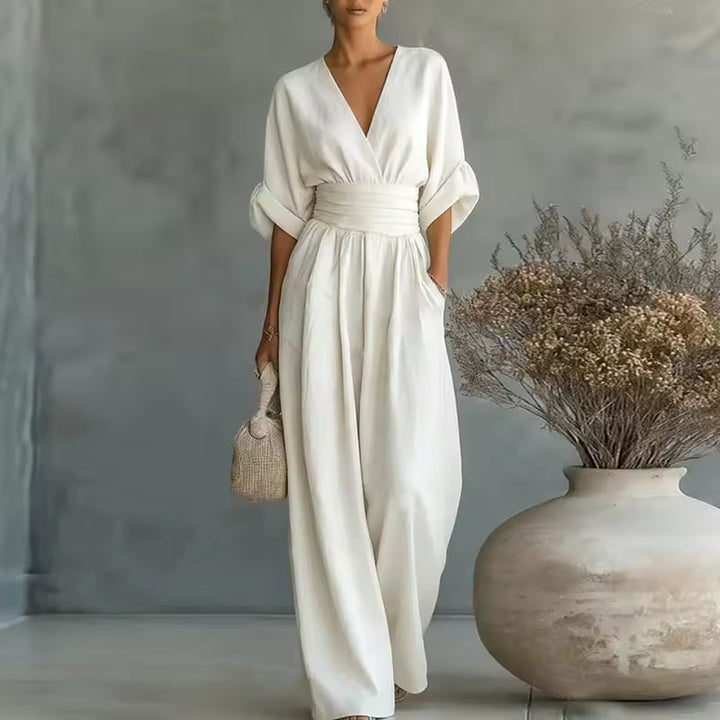 Elegant women's jumpsuit with a deep V-neckline and wide legs